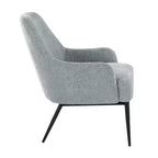 Sillón tapizado, estructura de metal negro, azul claro